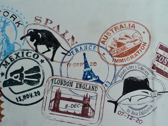 Passport stamps collected from travels around the world